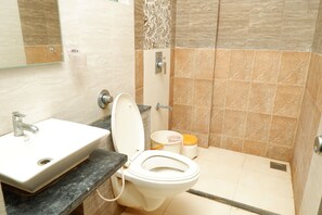 Shower, rainfall showerhead, towels, soap