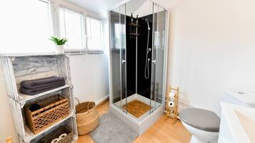 Shower, hair dryer, towels, soap