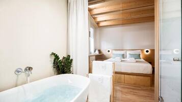 Deluxe Suite, Bath | Desk, soundproofing, free WiFi, bed sheets