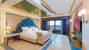 A luxurious hotel room with a large bed, a balcony with a view, and a modern design.