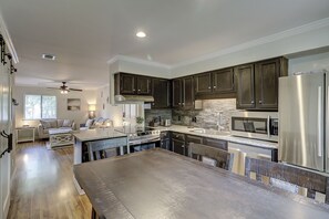 Fridge, microwave, coffee/tea maker, cookware/dishes/utensils