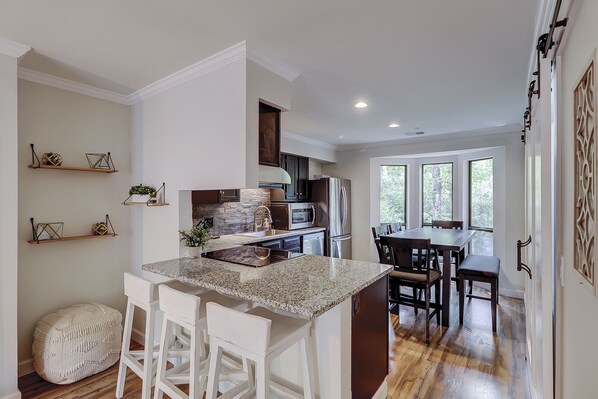 Fridge, microwave, coffee/tea maker, cookware/dishes/utensils