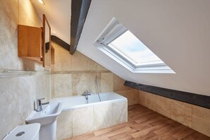 Bathtub, hair dryer, towels