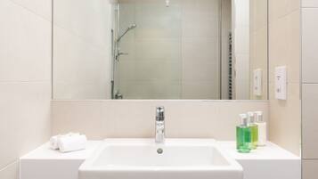 Studio - No Window | Bathroom | Shower, hair dryer, towels