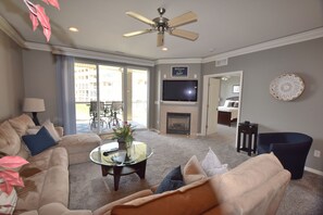 A living room with a sofa, coffee table, and a fireplace. - Welcome to Paradise!Screened Patio-LANDS END 12 x 36 Boat slip  Sleeps 6-8
GRILL (Osage Beach)