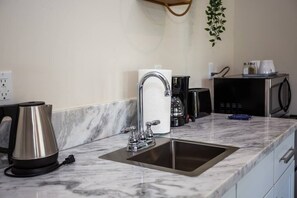 Mini-fridge, microwave, coffee/tea maker, electric kettle