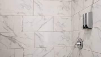 Shower, hair dryer, towels, shampoo