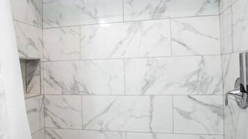 Shower, hair dryer, towels, shampoo