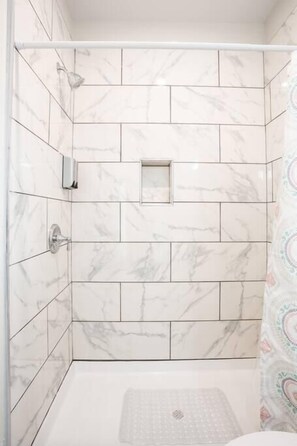 Shower, hair dryer, towels, shampoo