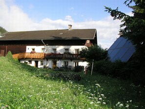 A two-story building with a balcony, a satellite dish, and a solar panel. - Cozy Angererhof: Close to Drei Zinnen - Monte Paterno (4P) - FRIENDLY (Kartitsch)
