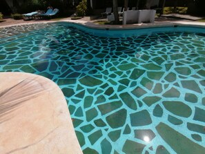 A swimming pool with a mosaic tile design. - Johari Villas (Malindi)