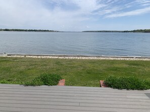 Enjoy a serene lakeside view from the comfort of your accommodation.