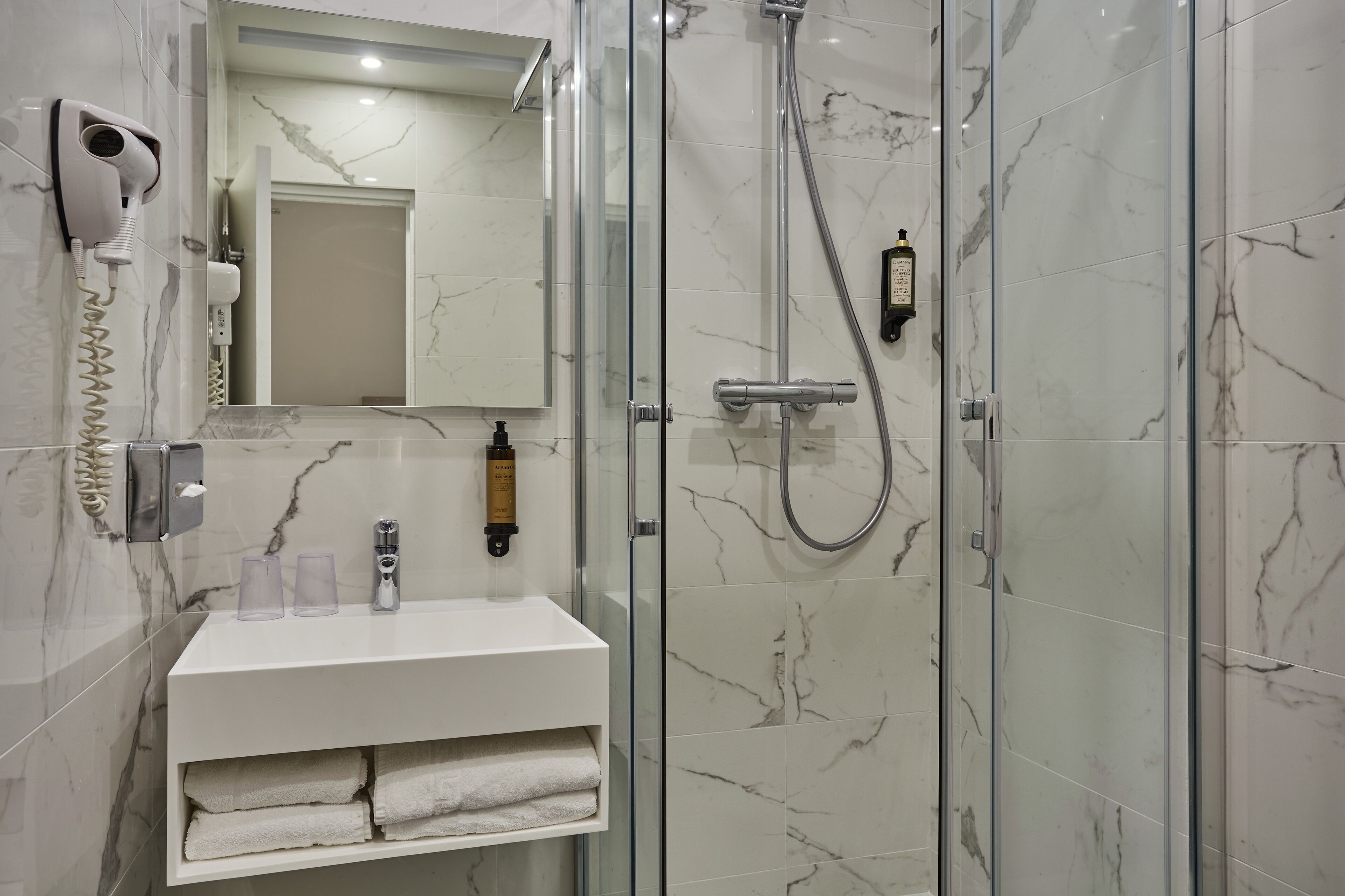 superior double room | bathroom | hair dryer, towels