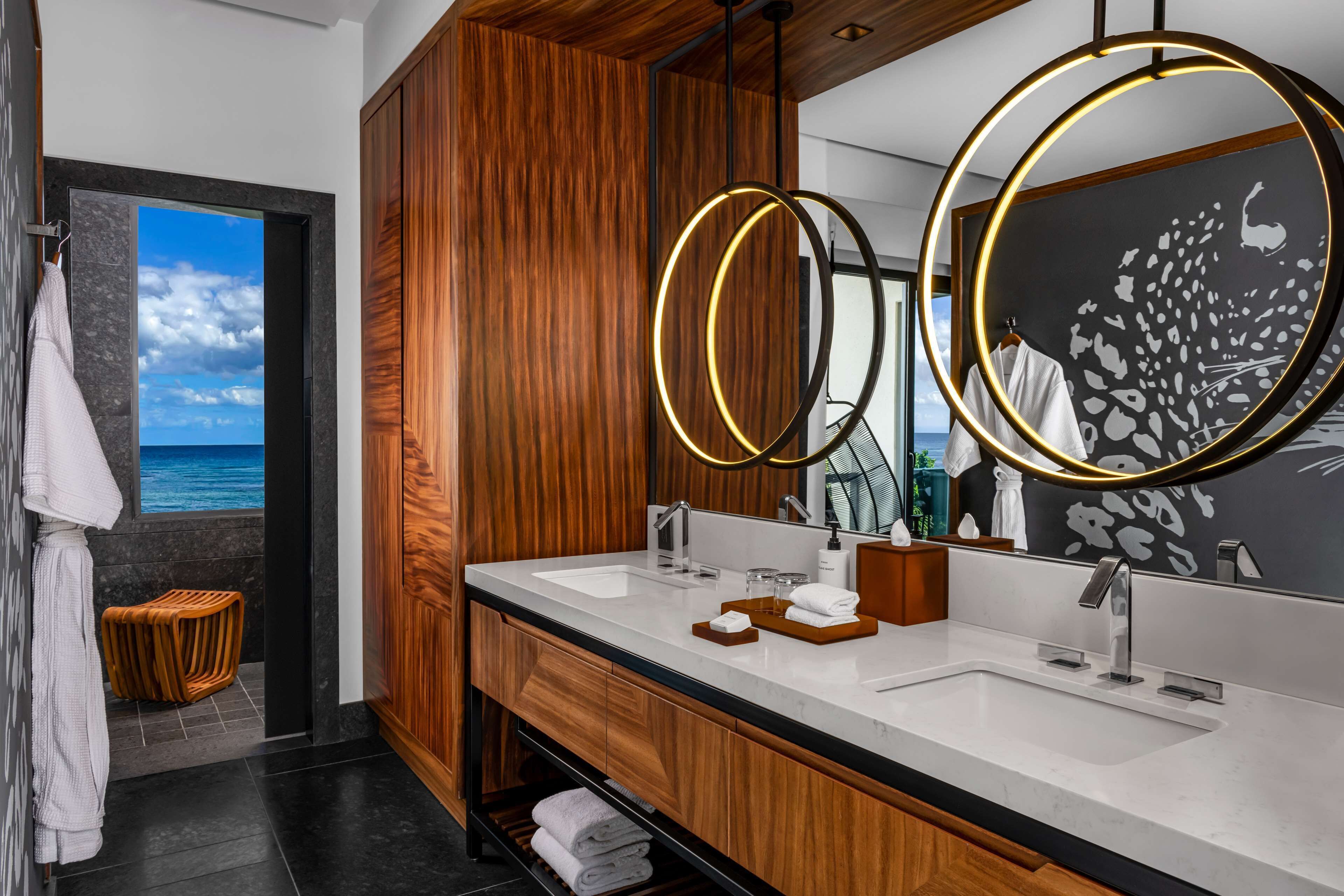 designer toiletries, hair dryer, towels, soap