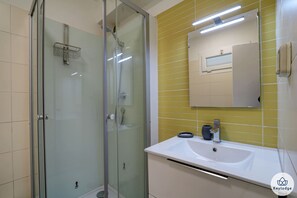 Shower, hair dryer, towels, soap