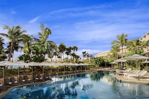 On the beach, white sand, sun loungers, beach umbrellas