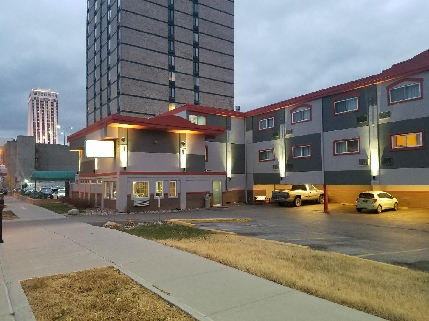A multi-story building with a parking lot.