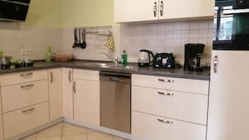 Fridge, stovetop, dishwasher, coffee/tea maker