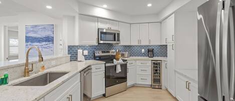 Coffee/tea maker, fridge, microwave, oven