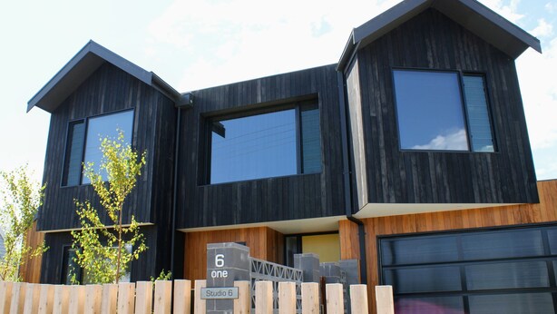 A modern two-story house with large windows and a garage. - Apartment Studio 6: In The Heart of Torquay (Torquay)