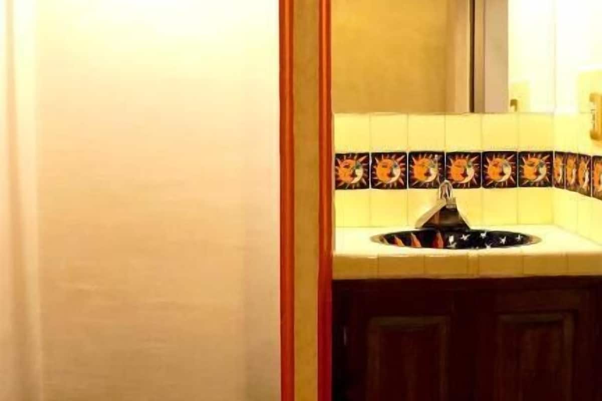 comfort room | bathroom | rainfall showerhead, designer toiletries, hair dryer, towels