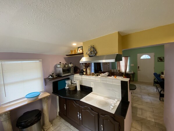 Fridge, microwave, stovetop, coffee/tea maker