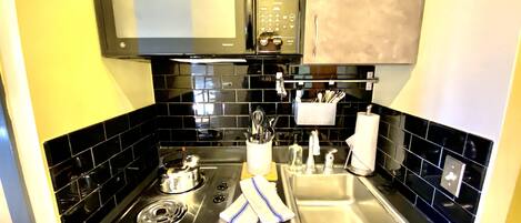 Fridge, microwave, stovetop, coffee/tea maker