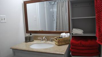 Bathtub, hair dryer, towels, soap