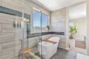 Combined shower/bathtub, hair dryer, towels, soap