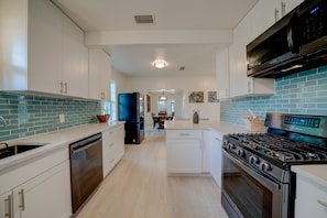 Fridge, microwave, oven, stovetop - Waterfront Home w/Resort Pool, Rooftop Deck, Large Primary Suite, Great Location (St. Augustine)