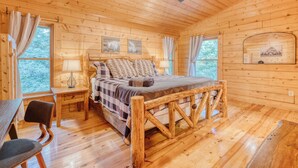 A wooden cabin room with a bed, desk, chair, and a ceiling fan. - 5 mins to DWTN & Lake, Arcade, Foosball. Best Location in Blue Ridge (Blue Ridge)