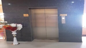 An elevator with a sign indicating it is out of service. - Royal City Dubai Hotel & Suites (Nkpor)