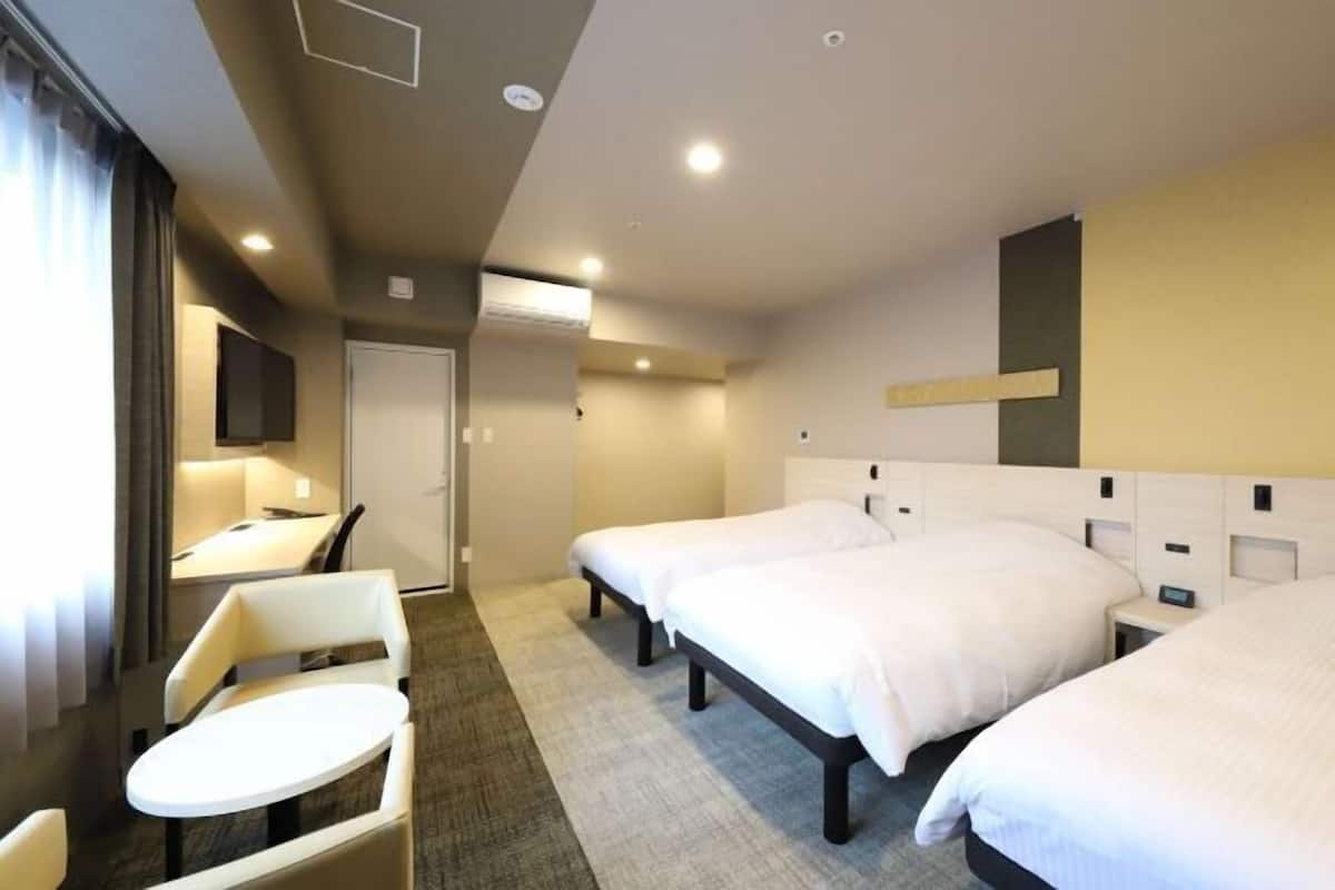 Desk, laptop workspace, free WiFi, bed sheets