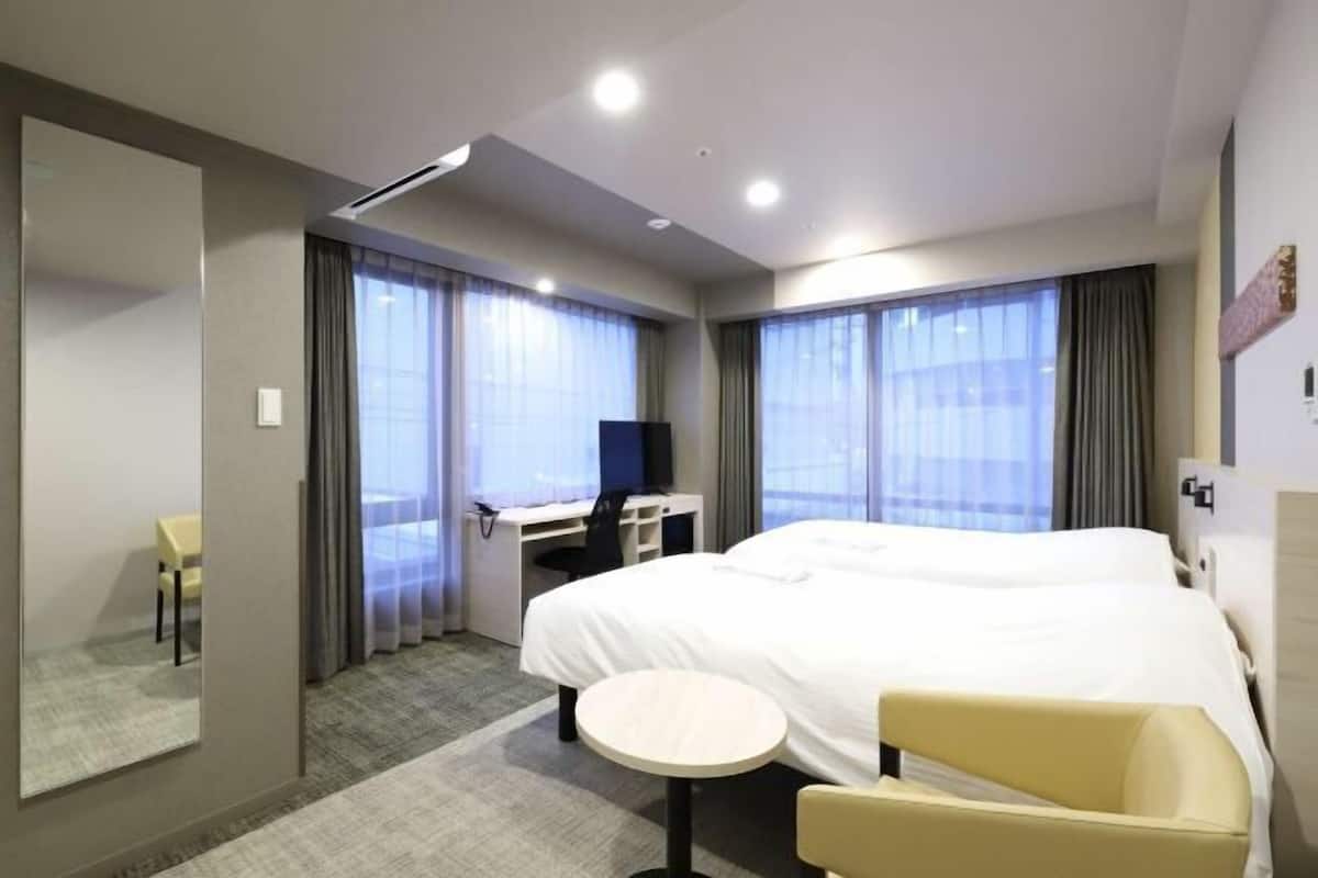 Desk, laptop workspace, free WiFi, bed sheets