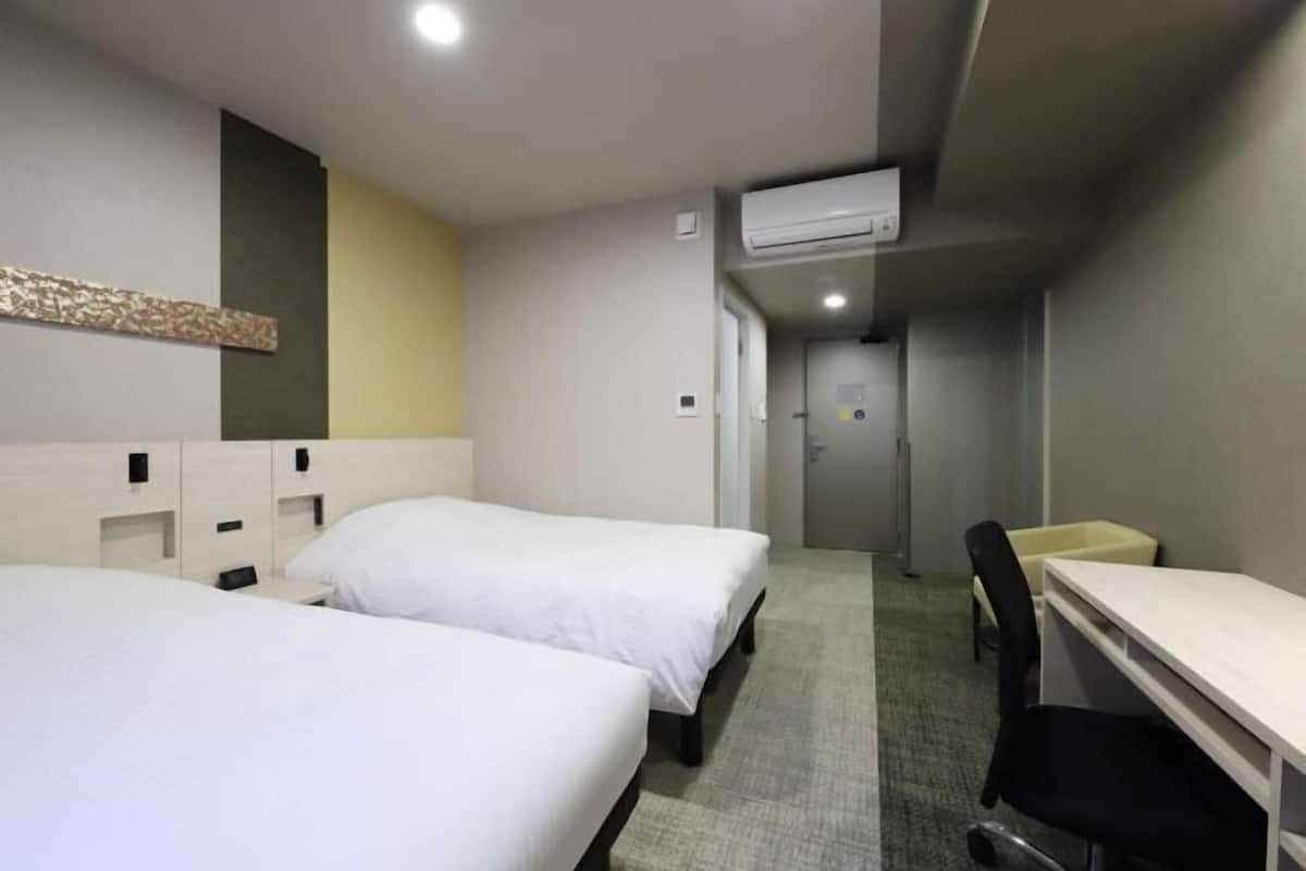 Desk, laptop workspace, free WiFi, bed sheets