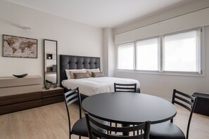 Classic Studio | Living area | 24-inch flat-screen TV with cable channels, TV - Boldrini Apartments by Wonderful Italy (Bologna)