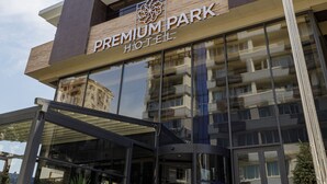 A modern hotel with a prominent sign reading "PREMIUM PARK HOTEL". - Premium Park Hotel (Baku)