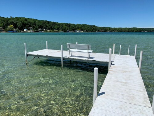 Torch Lake Oasis: Serene Views & Waterfront Bliss Await!