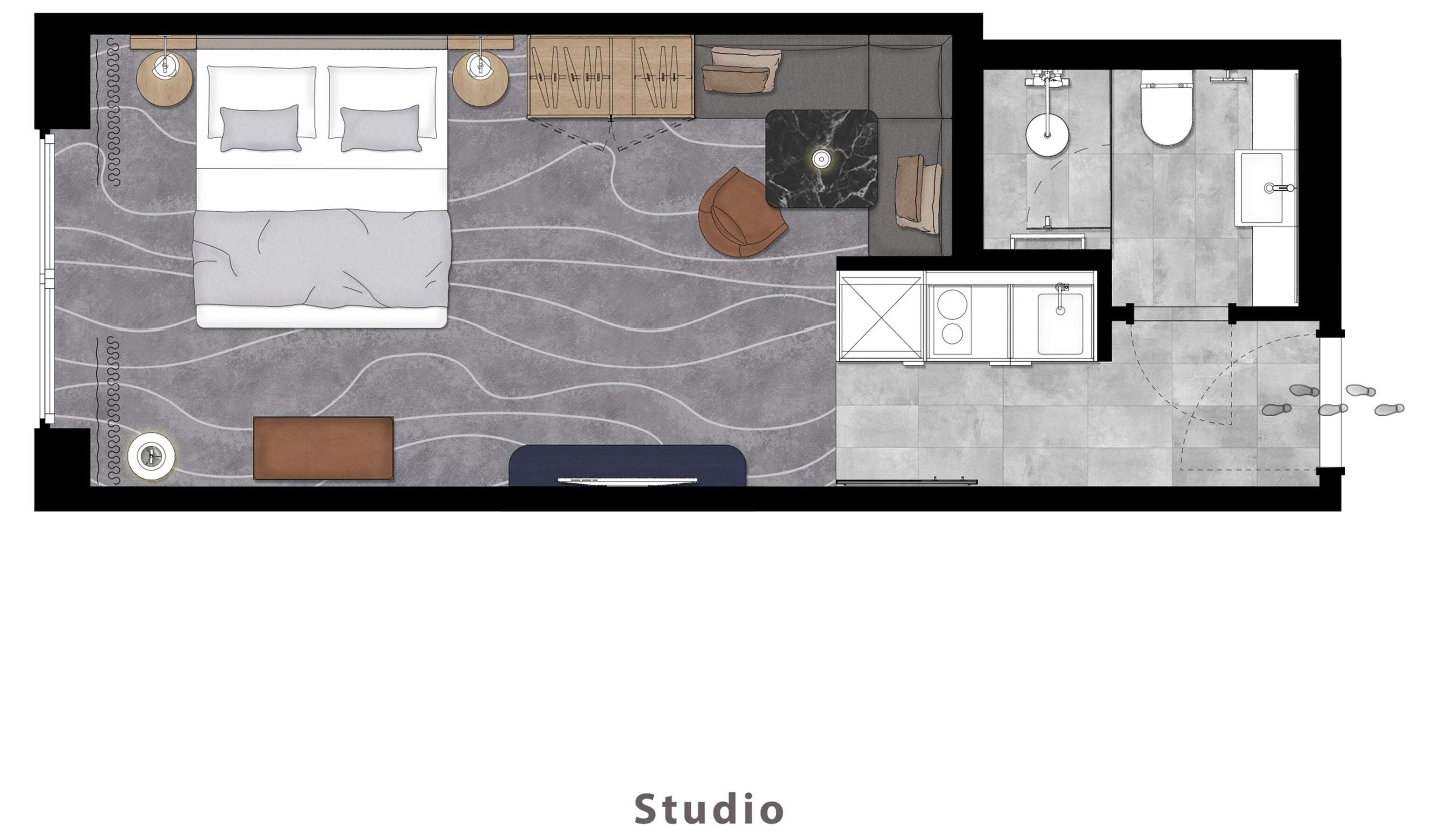A studio apartment layout with a bed, seating area, kitchenette, and bathroom.