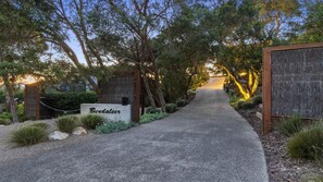 A pathway leading to a building with a sign reading "Bundaleer." - Bundaleer (Rye)
