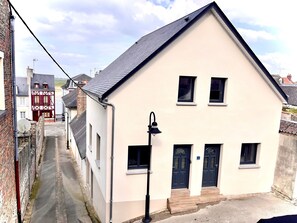 Traditional building with a central entrance and two-story facade.