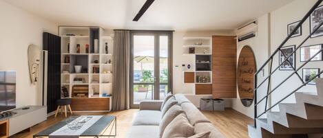 Apartment, 2 Bedrooms | Living area | 24-inch flat-screen TV with cable channels, TV