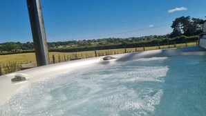 A hot tub with a view of a rural landscape. - The Shippon -hot Tub ext chg - Superking-log Fire (Preston)