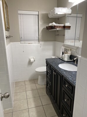 Combined shower/tub, hair dryer, towels, soap