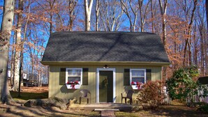 A small, single-story house with a brick pathway leading to the front door. - The Wright Place (Kingsport)