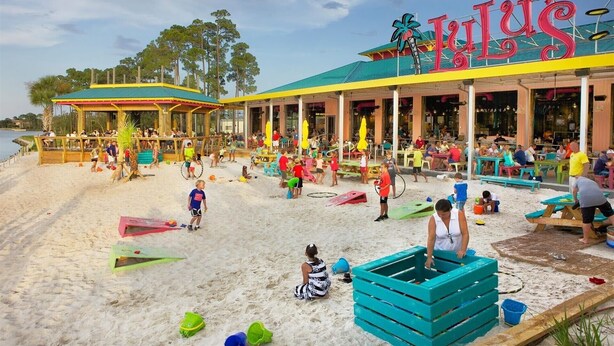 A beachside restaurant with outdoor seating and a pool area. - FREE GOLF CART. private HEATED pool option. Walk to the beach.Sleeps 10! (Destin)