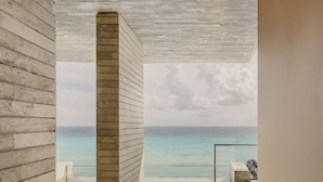 A modern spa room with a large bathtub, a view of the ocean, and a wooden ceiling. - La Casa de la Playa by Xcaret-All Inclusive, Adults Only (Playa del Carmen)