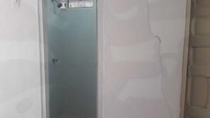 Shower, towels, soap, toilet paper