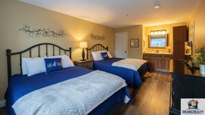 A hotel room with two beds, a kitchenette, and a bathroom. - Walk-In Branson Condo w/ Pool + Easy Access | Club C-7 (Branson)