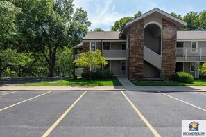Stunning two-story building with a central arched entrance and balcony.